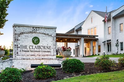 Entrance of The Claiborne retirement community with signage