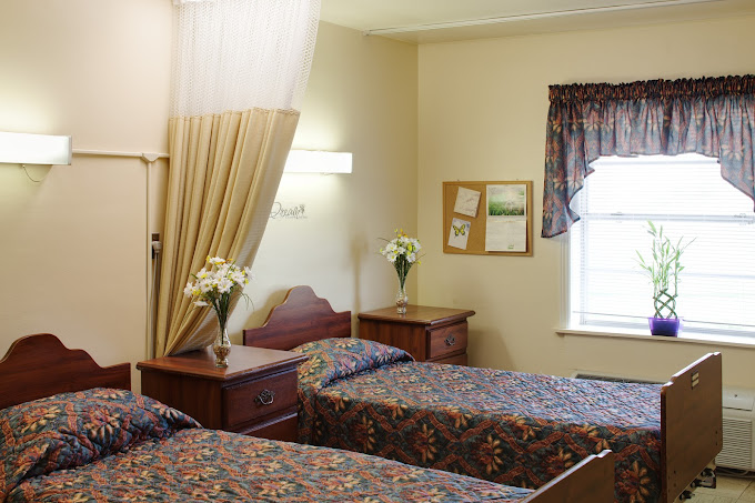 A cozy shared bedroom in an assisted living facility