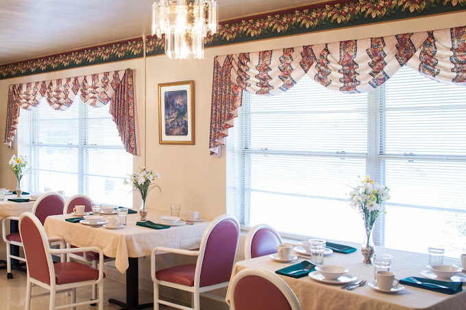Bright dining room with tables set for meals