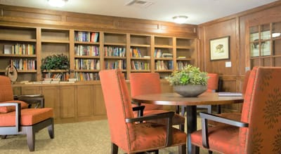 Cozy common area with bookshelves and seating