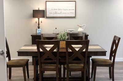 Well-decorated dining area with wooden table and chairs