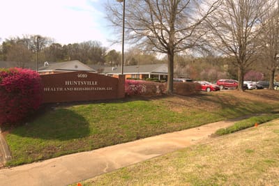 Exterior view of Huntsville Health and Rehabilitation facility sign
