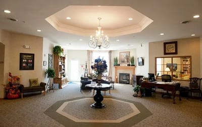 Common area with seating and decor in an assisted living facility