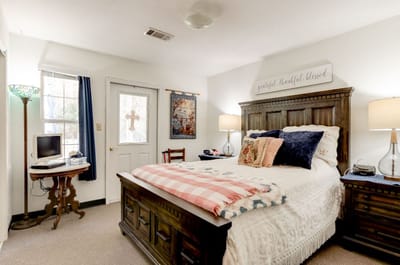 Cozy resident room with bed and personal decor