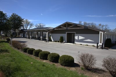 Exterior view of the assisted living facility with landscaping