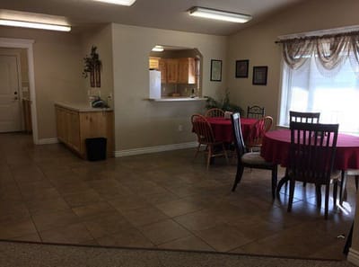 Bright common area with dining tables and chairs