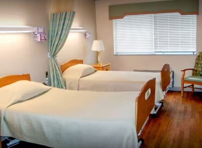 Shared resident room with two beds and window
