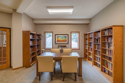 Interior view of a library with bookshelves and seating