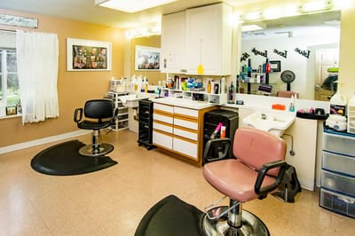 Interior view of a salon area with styling chairs