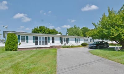 Exterior view of Edlyn Care facility with landscaping