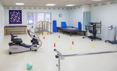 Rehabilitation gym with exercise equipment and therapy tools