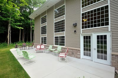 Outdoor seating area with chairs next to the facility