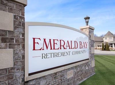Sign for Emerald Bay Retirement Community at the entrance