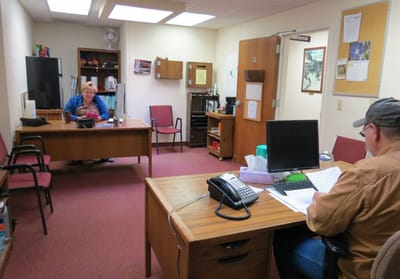 Interior view of an office space with staff
