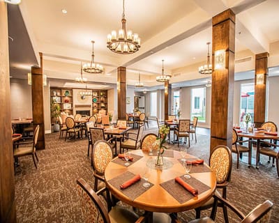 Dining room with tables set for residents