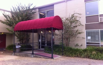 Entrance of a nursing home building with awning