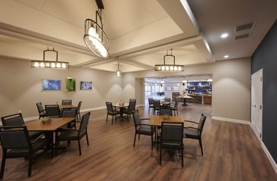 Modern dining area with tables and chairs in the facility