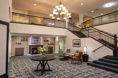 Bright and welcoming lobby area with seating and decorations