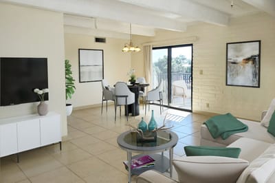Bright and inviting common area with seating and dining space