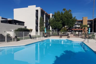 Swimming pool area with surrounding buildings