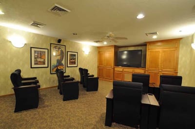 Interior of a common area with seating and a TV