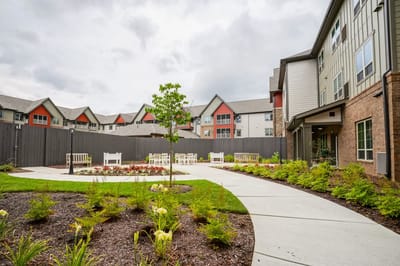 Outdoor garden area with seating and pathways