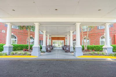 Covered entrance with seating at the facility