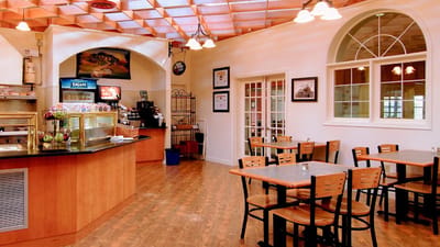 Interior view of a dining area with tables and chairs