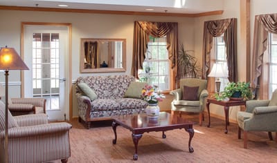 A cozy common area with comfortable seating and decor
