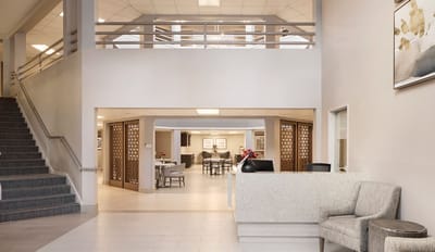Interior view of a common area with seating and dining.