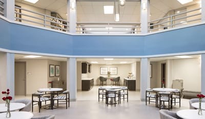 Bright common area with tables and seating