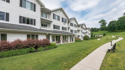 Exterior view of the assisted living facility with landscaped gardens
