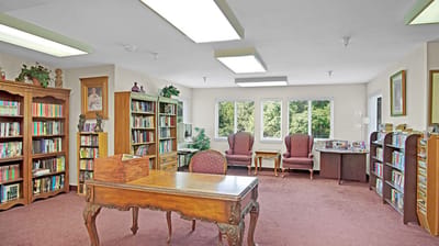 Bright common area with bookshelves and seating