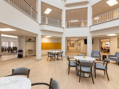Bright common area with tables and chairs