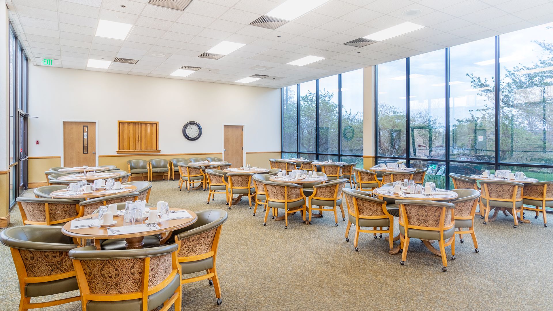 Bright dining room with arranged tables and chairs