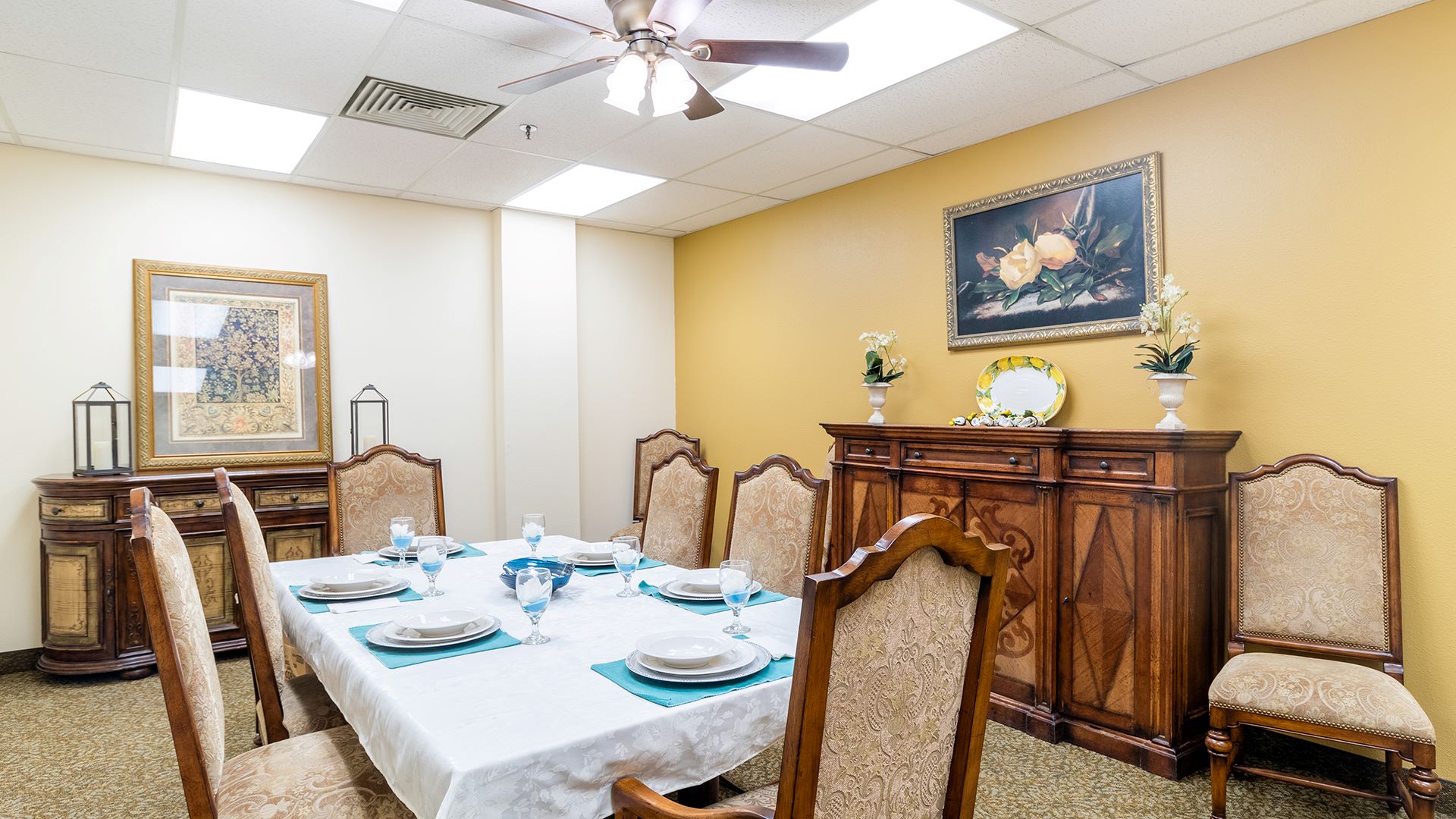 Dining room set for a meal in a warm interior space