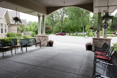Covered outdoor seating area with greenery