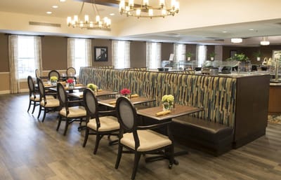 Dining area with tables and decorative flowers