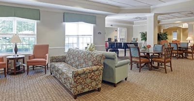 Common area with seating and tables in a bright interior