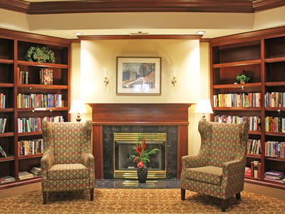 Cozy library area with comfortable seating and bookshelves