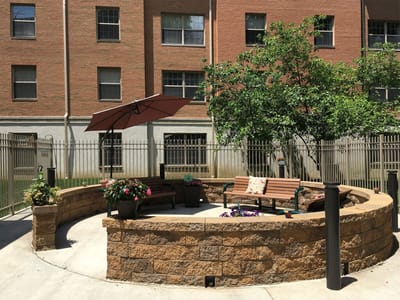 Outdoor seating area with benches and plants