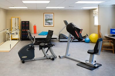 An interior view of a fitness area with equipment