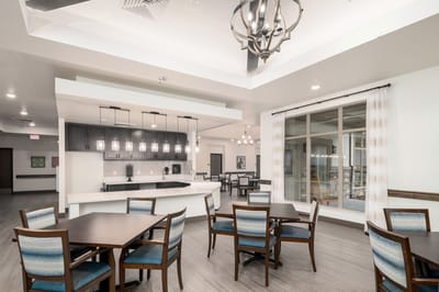 Bright common area with tables and chairs