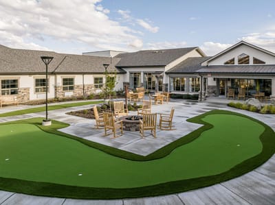Outdoor seating area with a landscaped putting green