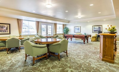 Bright common area with seating and game tables