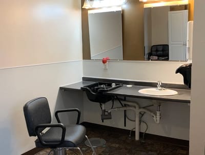 Salon area with hair washing station and chair