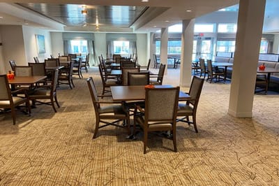 Bright dining area with wooden tables and chairs