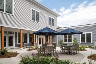 Outdoor courtyard area with seating and umbrellas