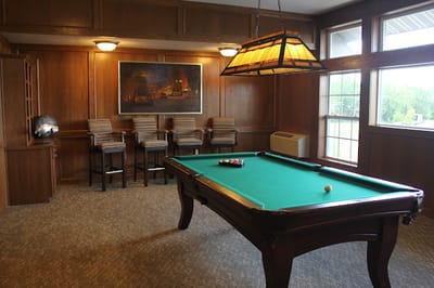 Interior common area with a pool table and seating