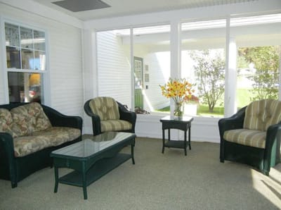 Bright common area with comfortable seating and flowers